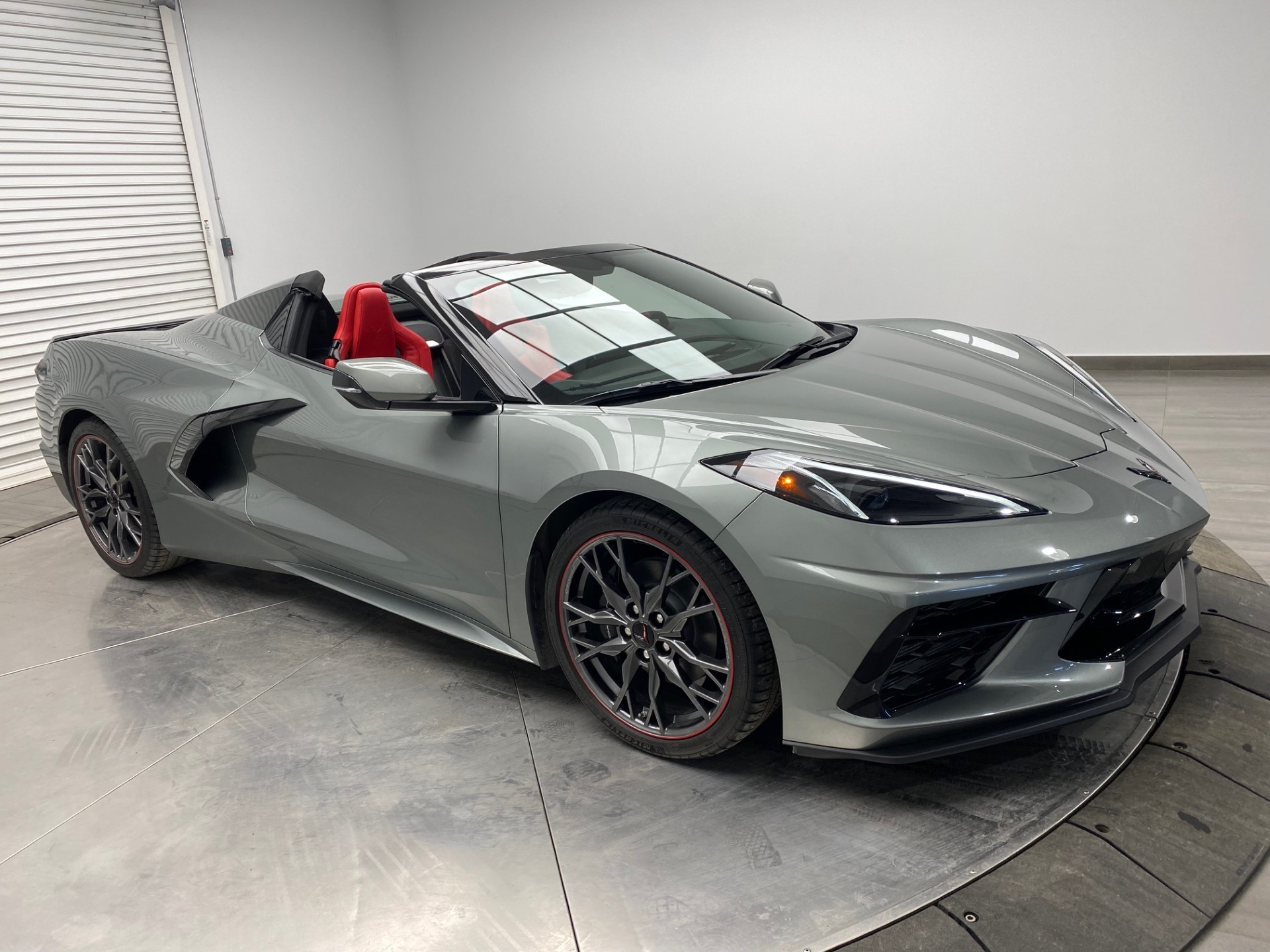 (SOLD) 2023 Chevrolet Corvette C8 Stingray Convertible, Hypersonic Grey Metallic Paint, Adrenaline Red Leather, Magnetic Ride Control, Performance Exhaust, GT1 Seats, Carbon Flash Forged Wheels, 1LT Preferred Group w/701km