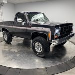 (SOLD) 1979 GMC K1500 Sierra Grande Short Box 4x4, Rebuilt LS 6.0L V8, 4L60 4-Speed Automatic Transmission, Stock Transfer Case, 3-4" Lift Kit, Rhino Bed Liner, Dakota Digital Gauges, Black Mica Paint, White & Grey Marble Interior, Restored Square Body Truck w/4828km
